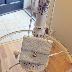 White Lisette crossbody bag,some wear and tear on the inside,outside is perfect